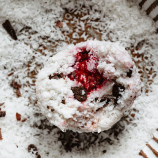 Closeup of coconut balls with raspberry in the center