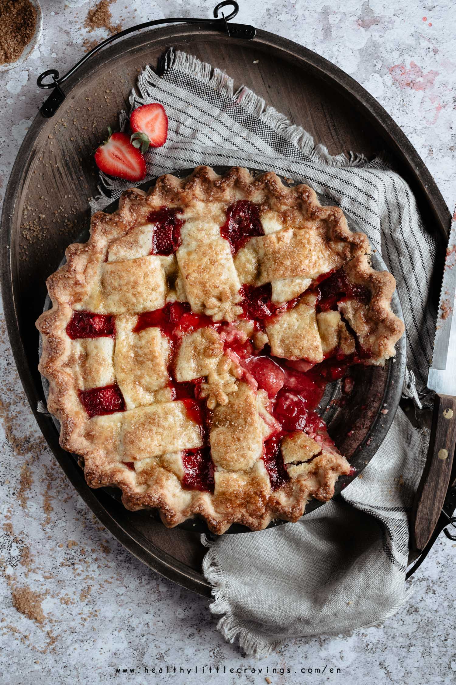 Strawberry pie with missing piece onto a tray