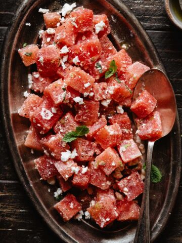 watermelon feta salad with mint leaves on top