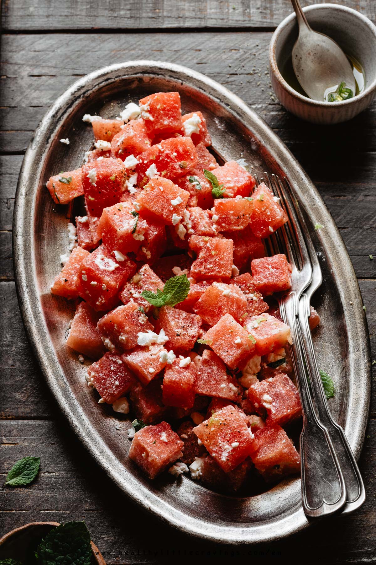 45° view of watermelon feta salad with mint leaves on top