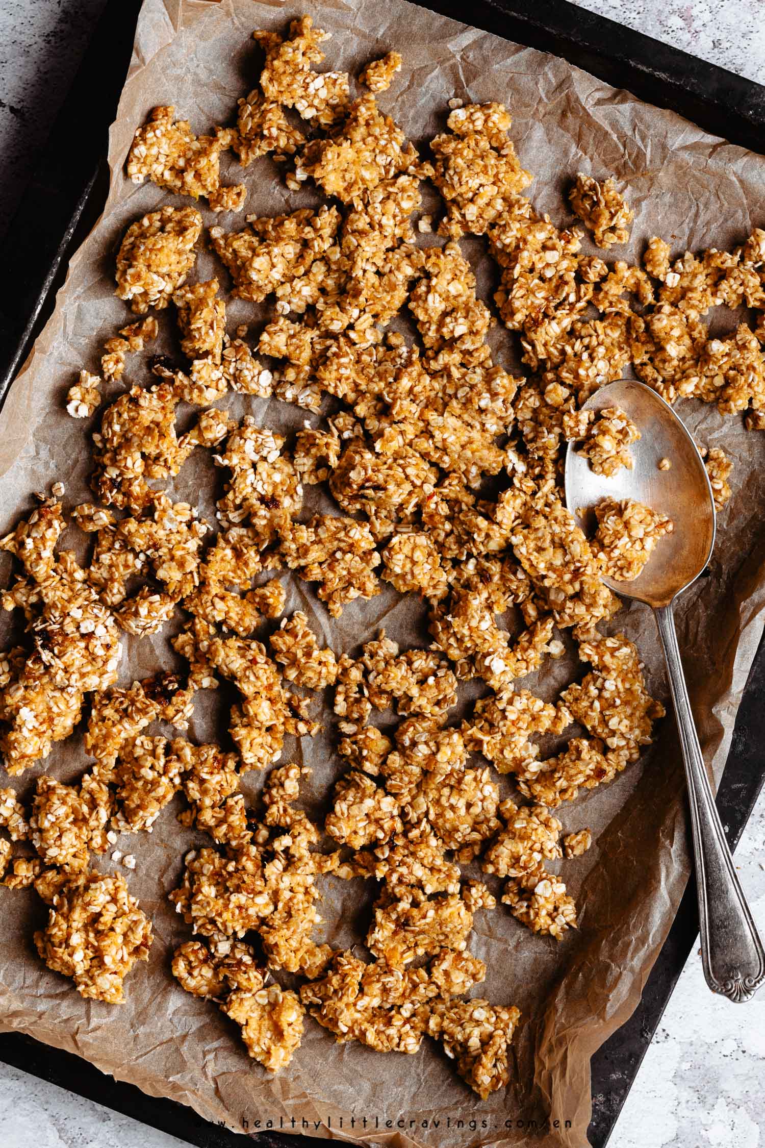 Pumpkin granola on a baking tray ready to be baked