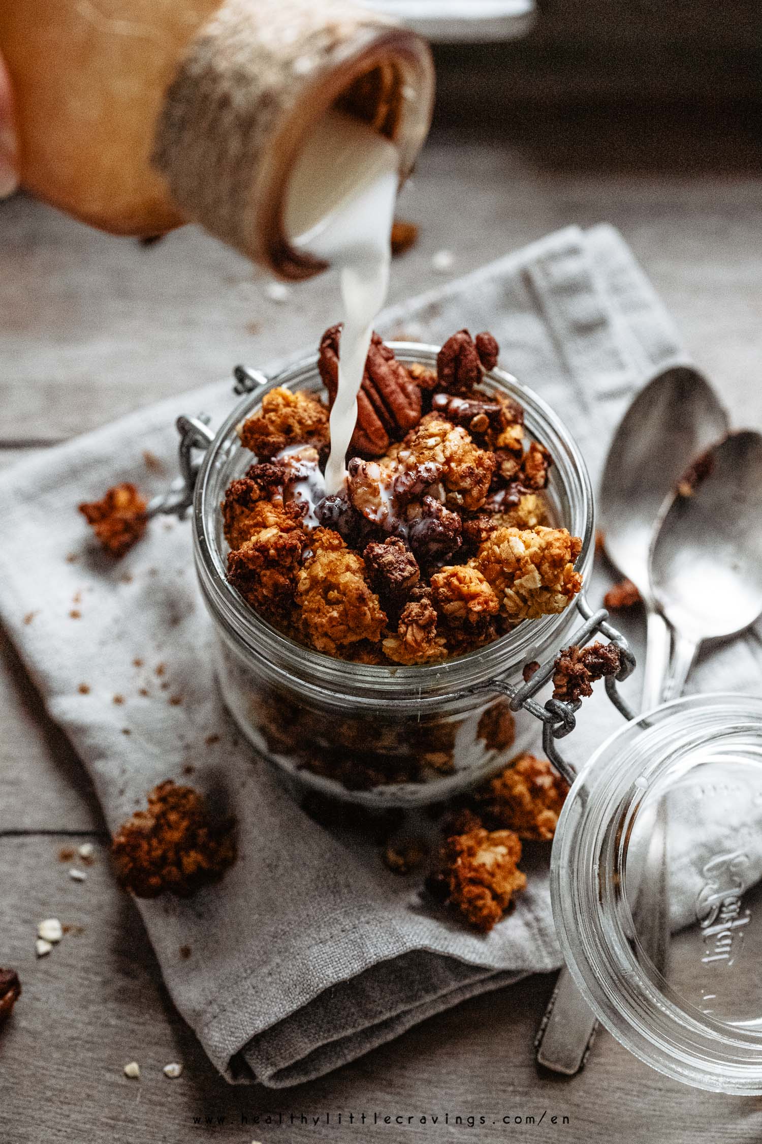 Pouring milk over pumpkin granola