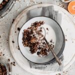 Healthy homemade granola with chocolate and orange served in a bowl