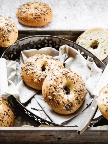 Homemade bagels are the best: soft and chewy bagels on a baking tray: my traditional bagel recipe
