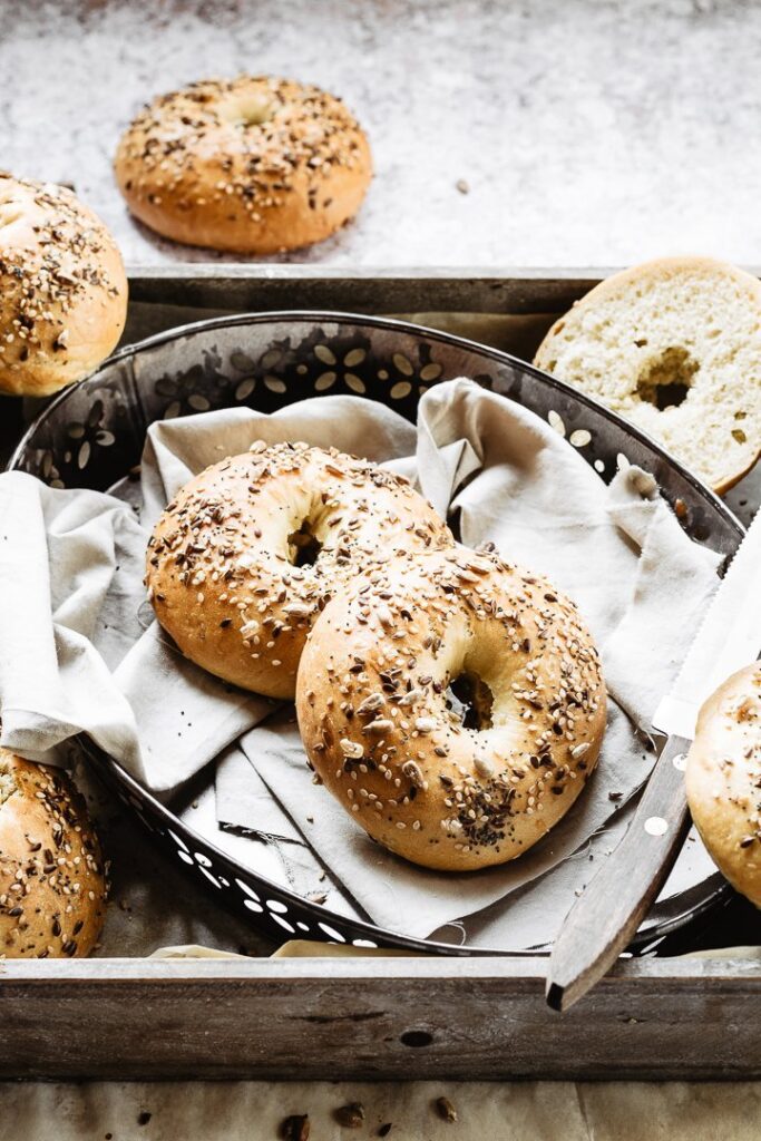 Homemade bagels are the best: soft and chewy bagels on a baking tray: my traditional bagel recipe