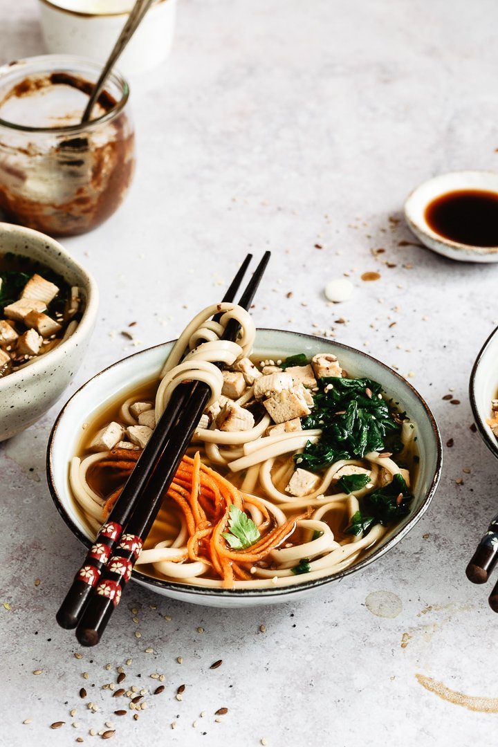 Easy and quick vegan ramen recipe. Soup served in a bowl with chopsticks