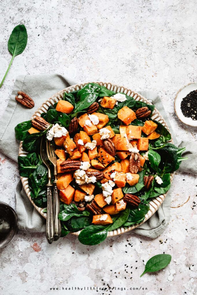 A spinach goat cheese salad on a napkin