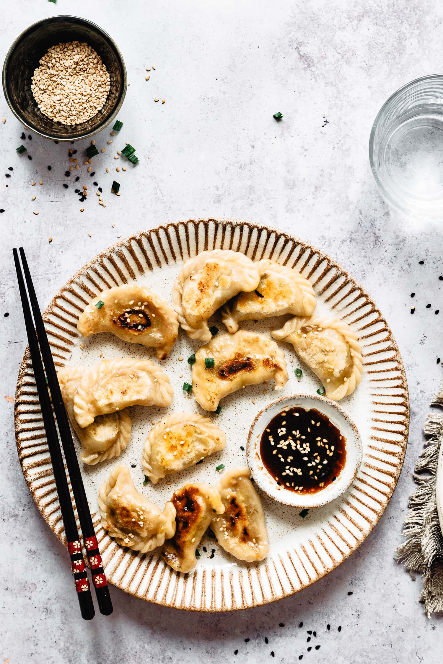 Easy vegan potstickers recipe: potstickers on a plate with sauce