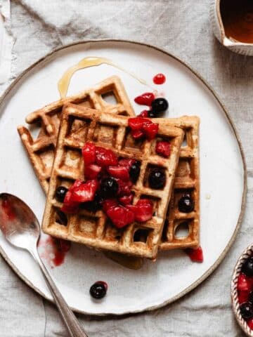 No baking powder powder waffles topped with strawberries and blueberries