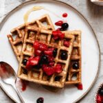 No baking powder powder waffles topped with strawberries and blueberries