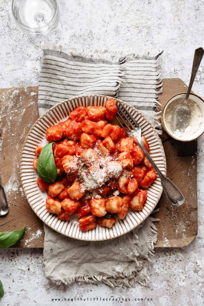 A plate of italian gnocchi with parmesan cheese