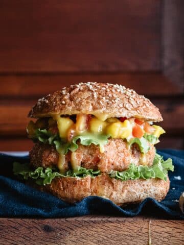 Closeup of grilled salmon burger with mustard and honey