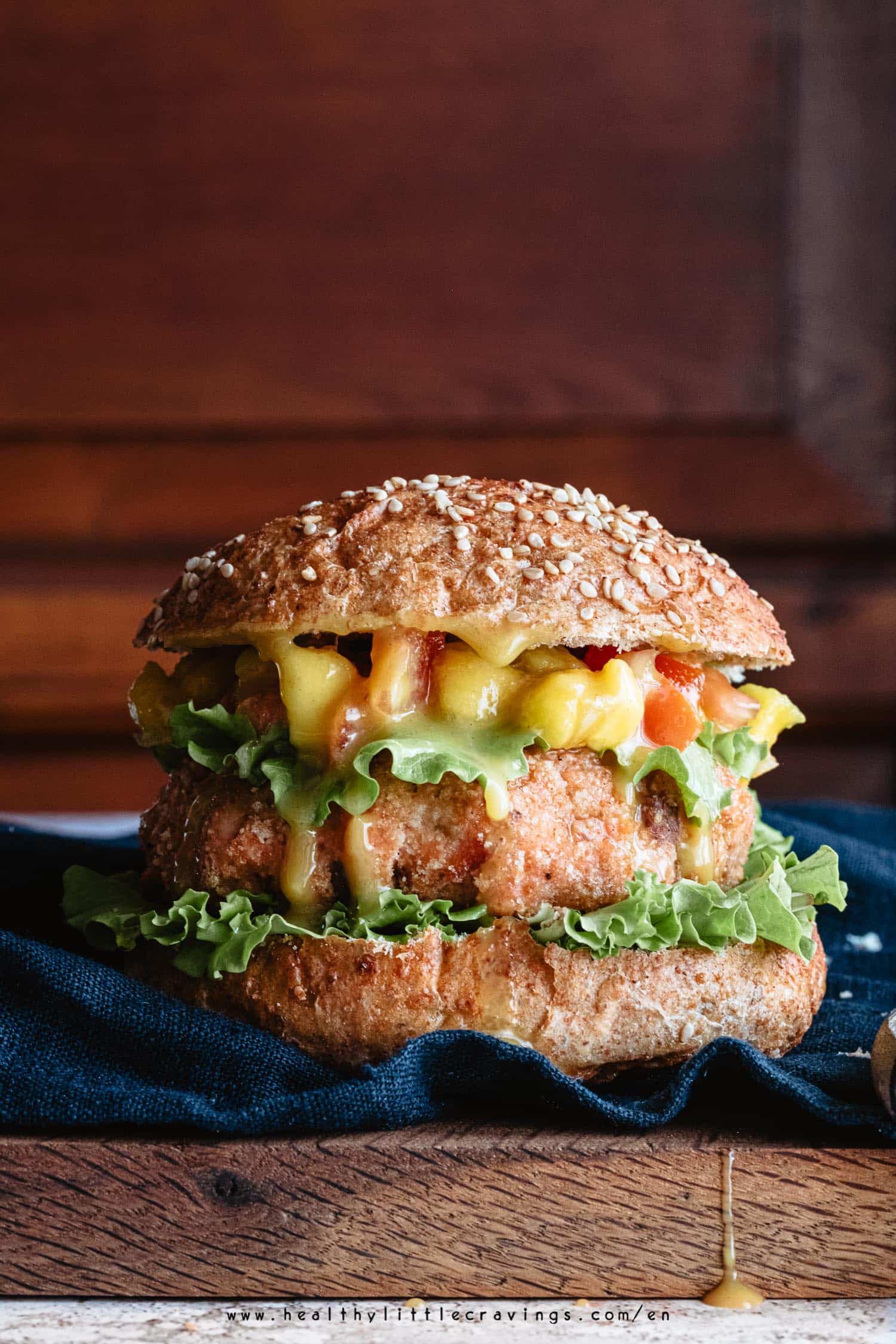 Closeup of grilled salmon burger with mustard and honey