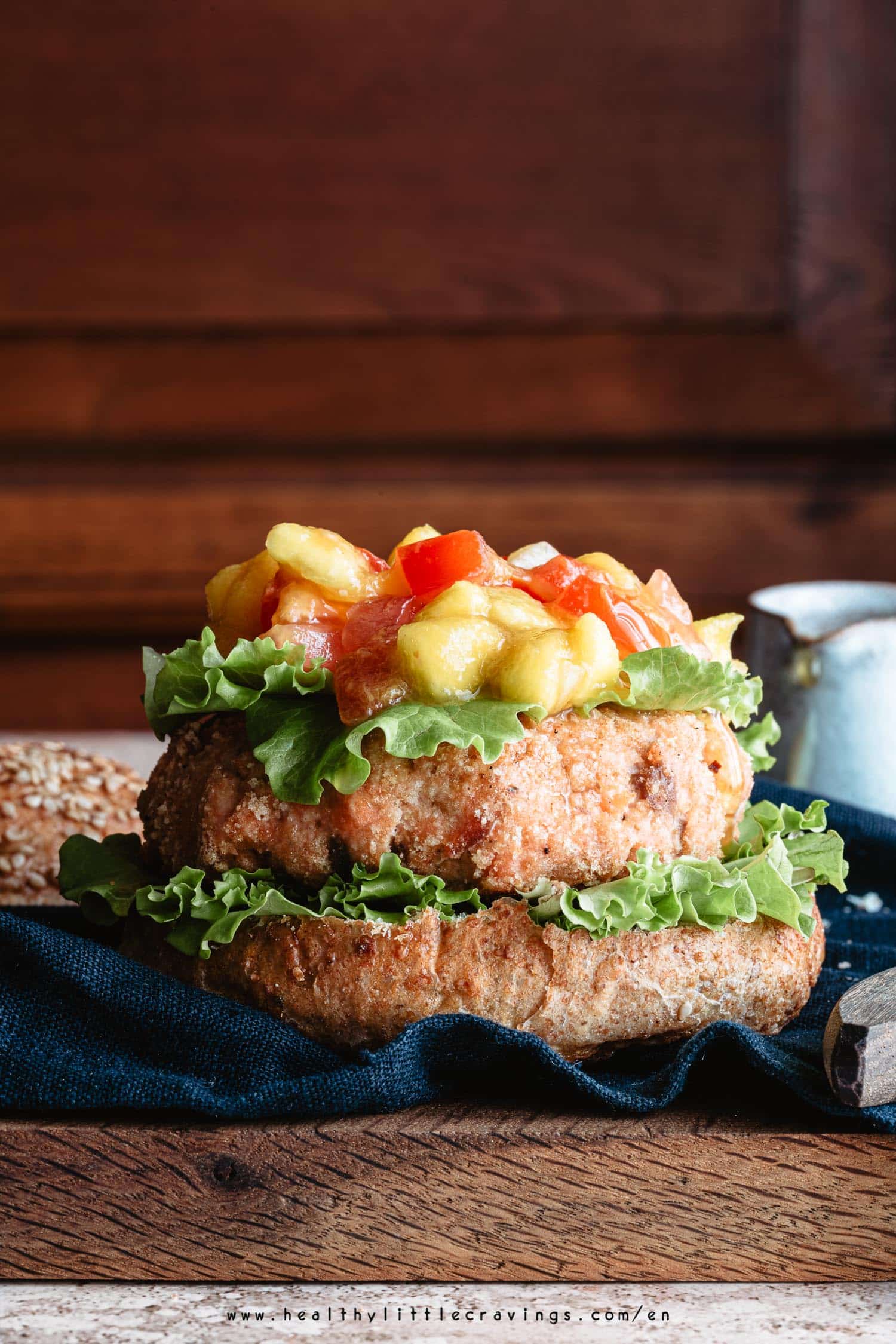 Mango salsa on top of a salmon burger