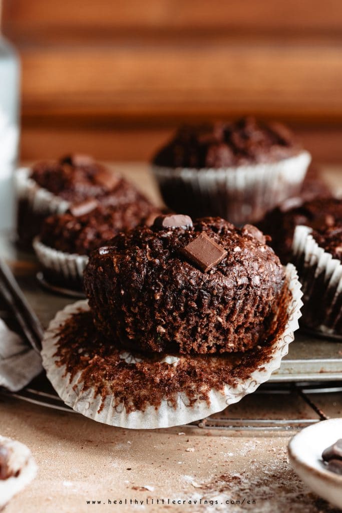 A single chocolate muffin on muffin tin