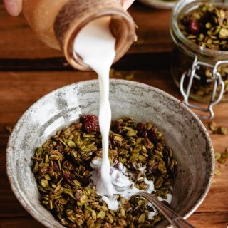 Pouring milk on granola photography