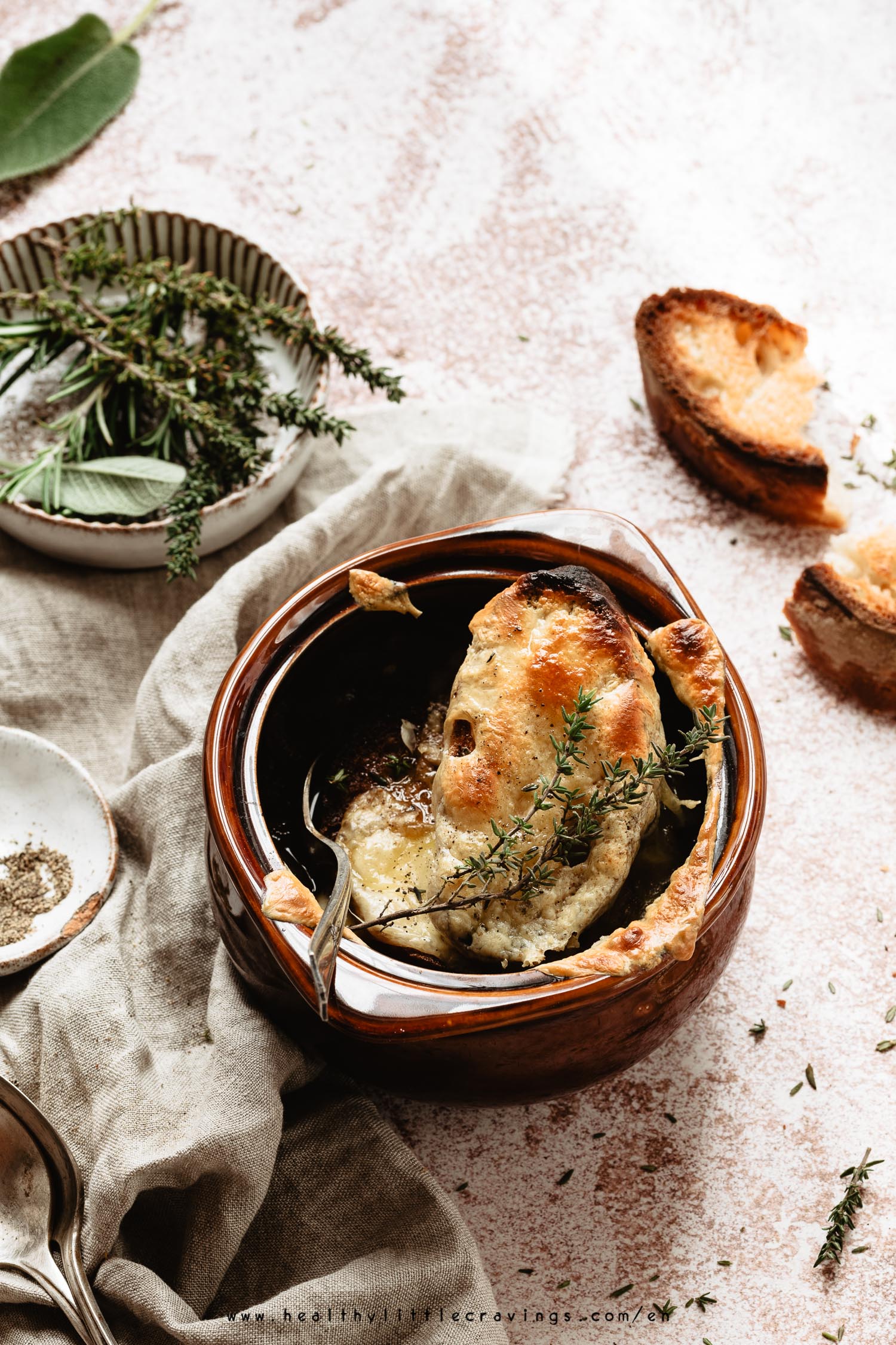 A delicious vegetarian french onion soup into a cocotte