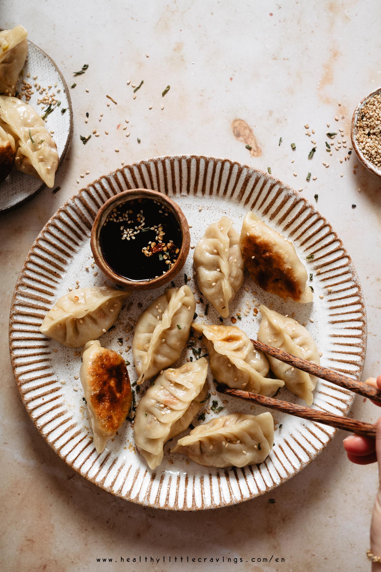 Chopsticks picking up a dumplings