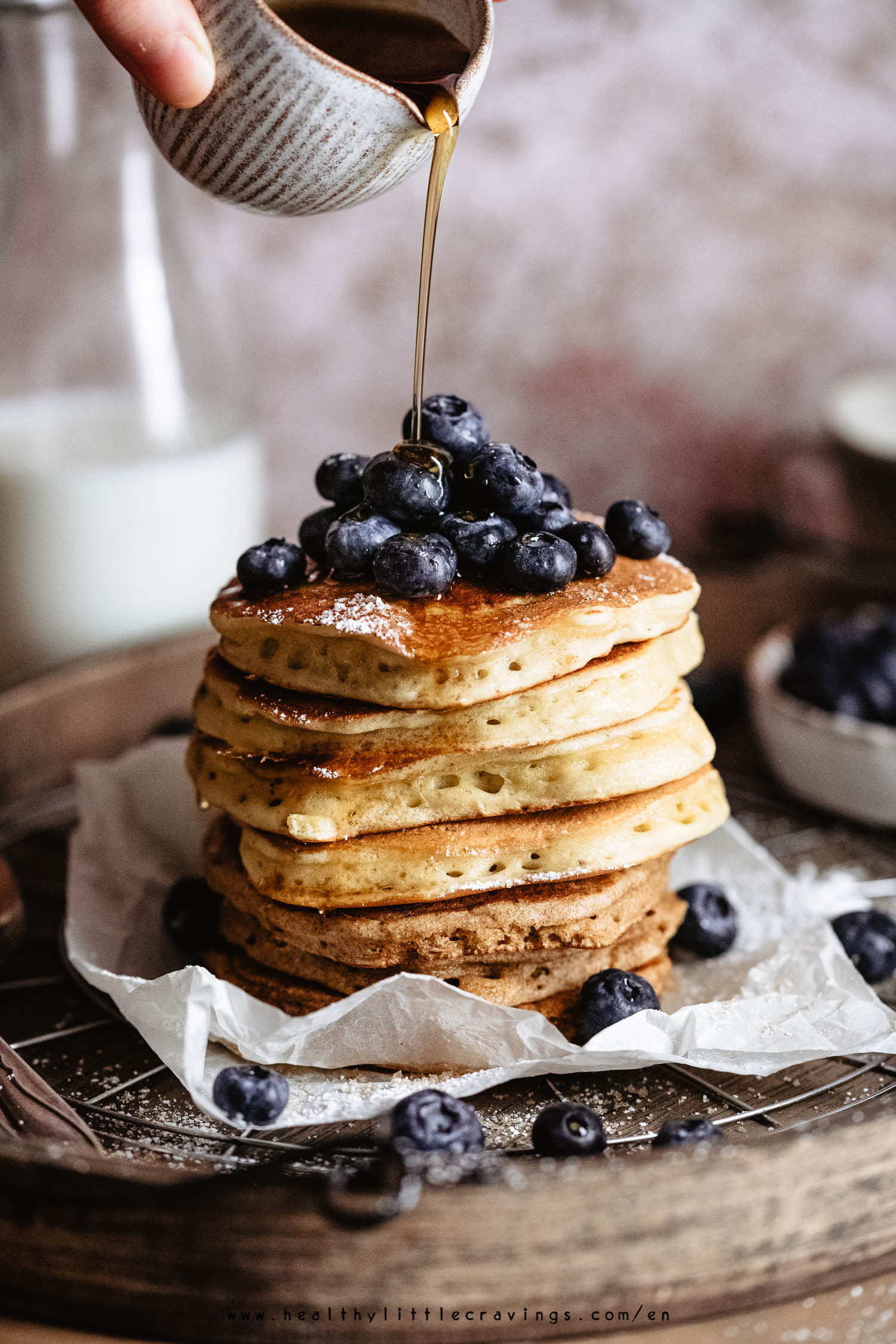 Drizzle of maple syrup on fluffy pancakes