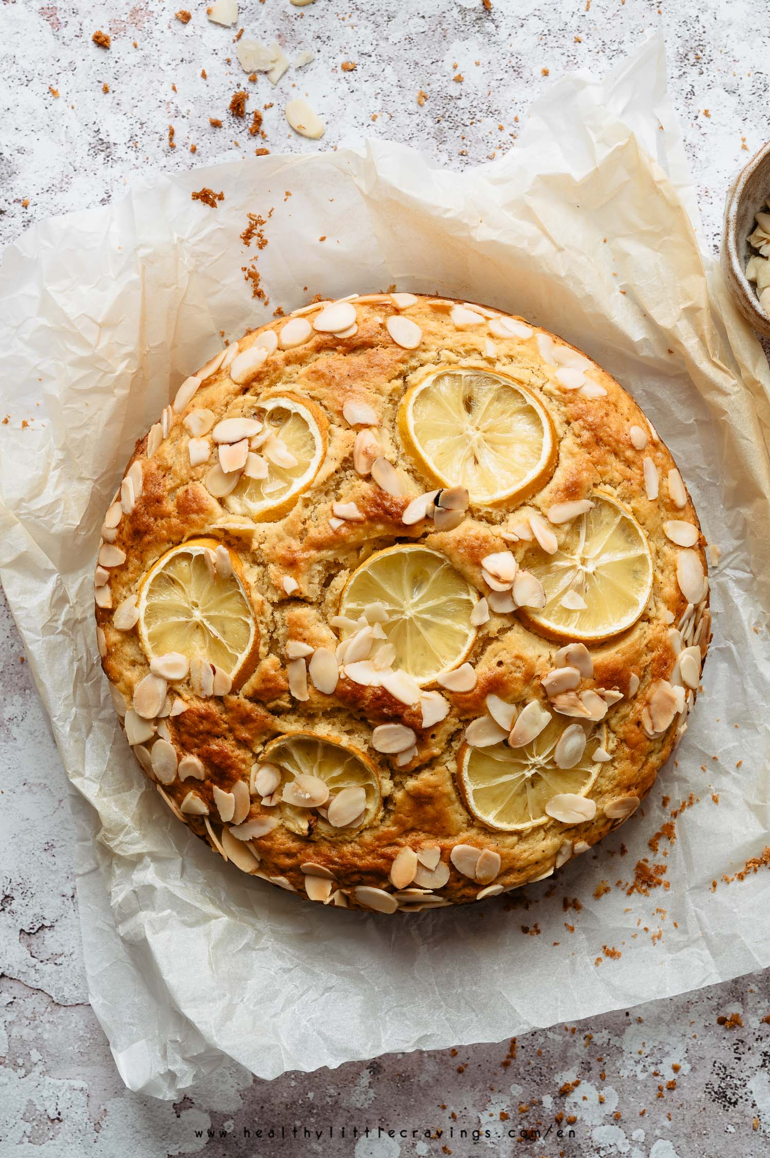 Beautiful lemon ricotta cake on parchment paper