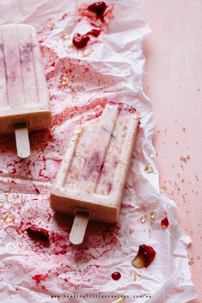 45 angle shot of Yogurt popsicles with apricots and strawberries 