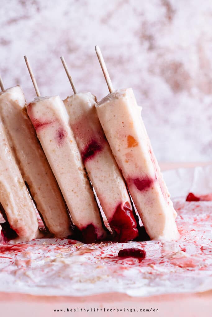 multiple Yogurt popsicles with strawberries and apricots