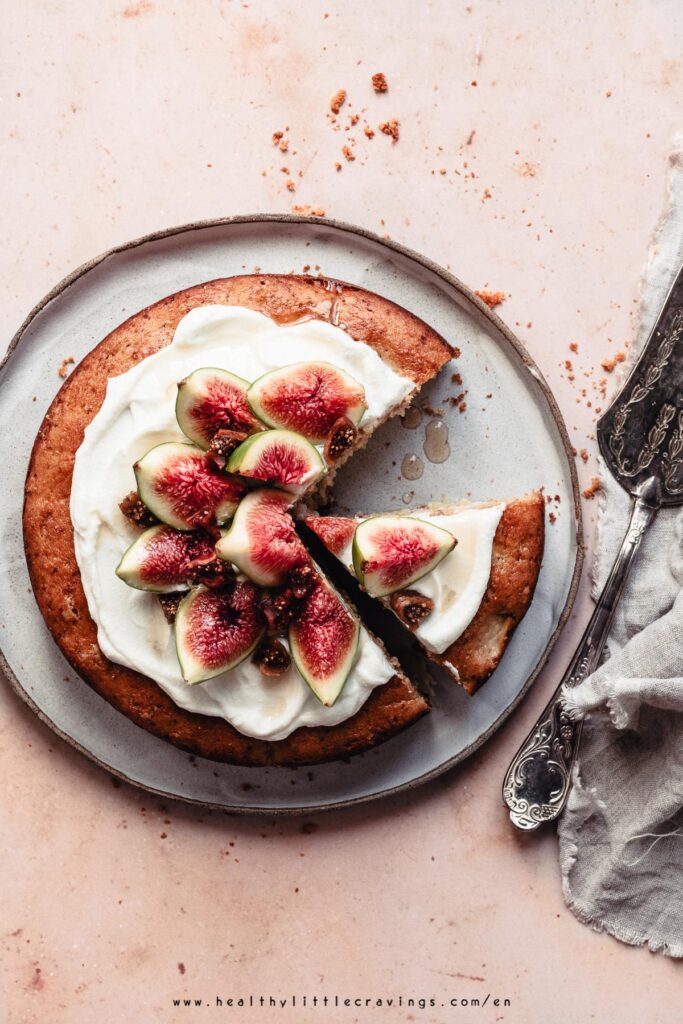 Sliced apple fig cake on a plate.