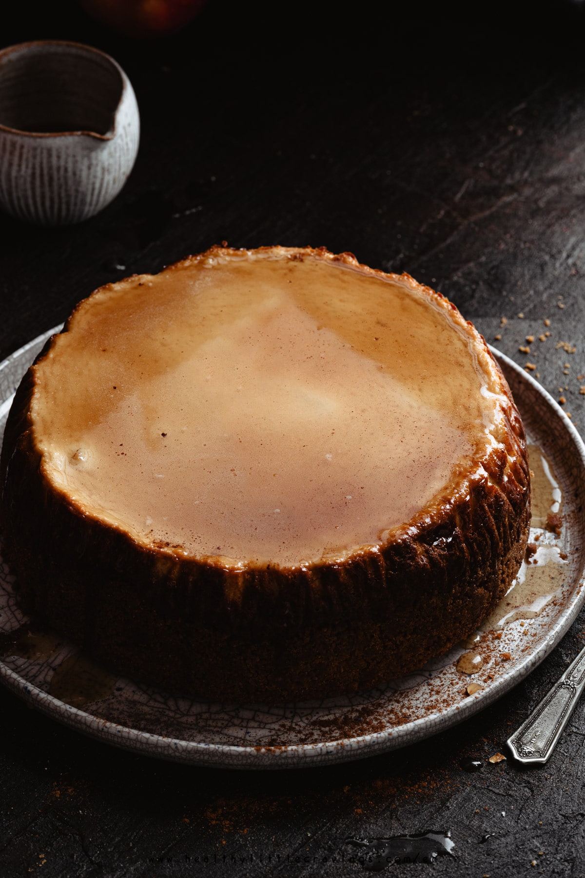 Delicious caramel apple cheesecake with a layer of caramel.