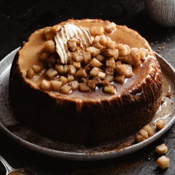 A caramel apple cheesecake on a plate.