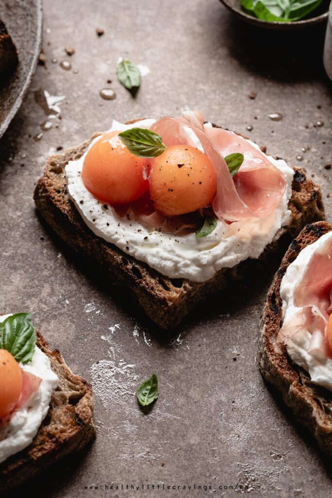 Prosciutto And Melon Crostini With Goat Cheese