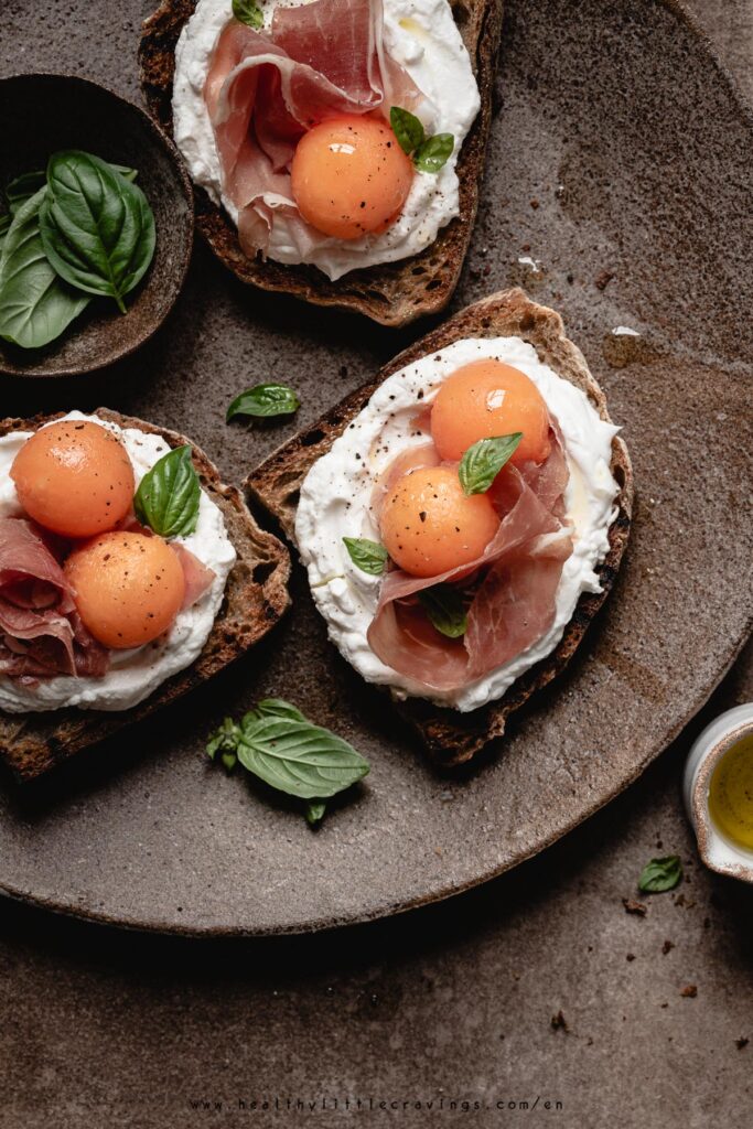 Prosciutto And Melon Crostini With Goat Cheese
