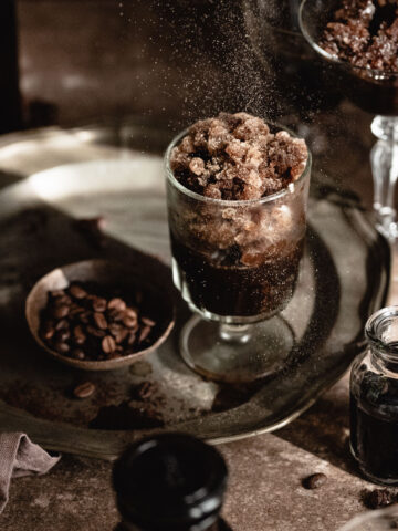 Espresso coffee granita with cardamom powder served into a vintage glass.