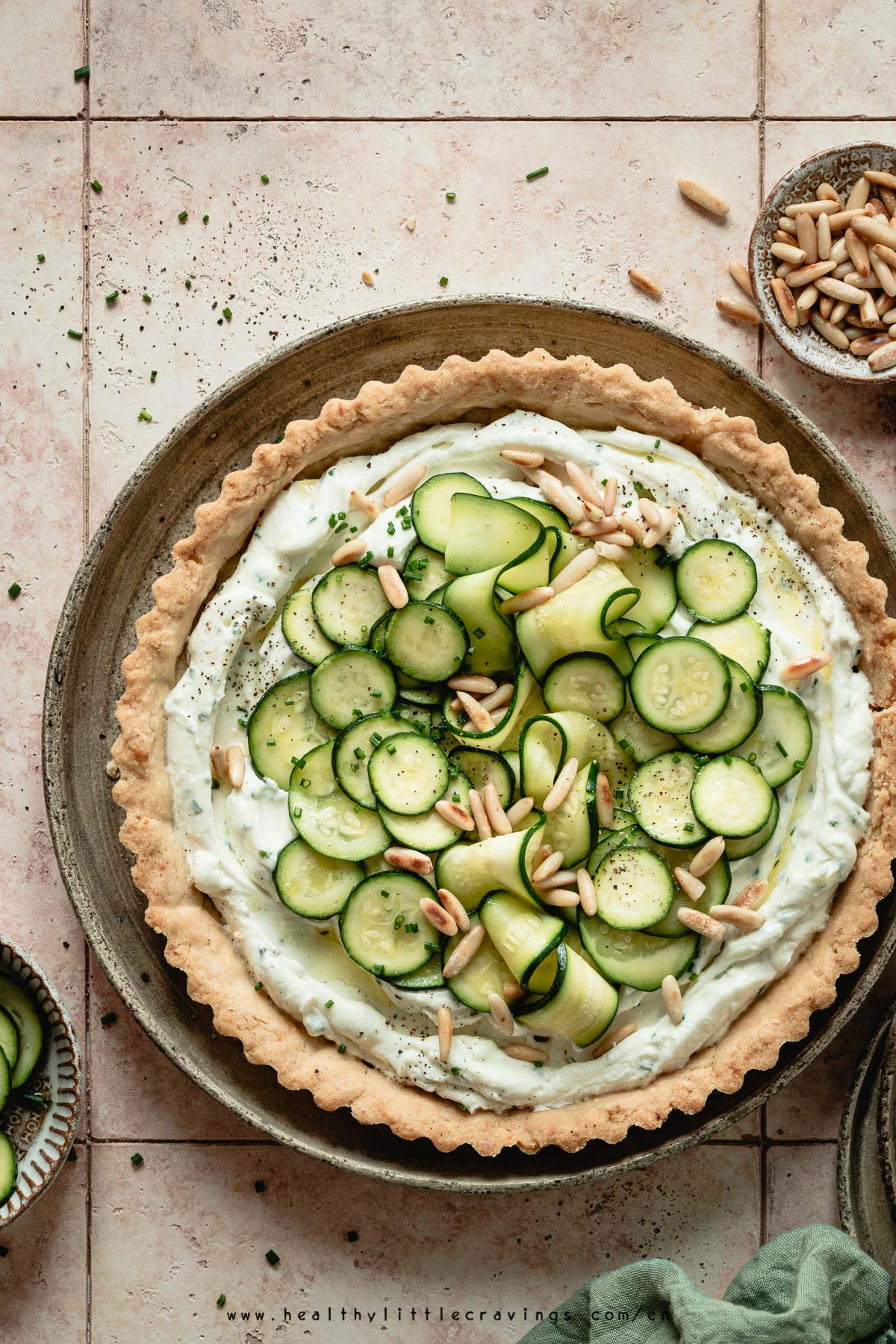 A delicious zucchini pie with feta cheese, on tiles